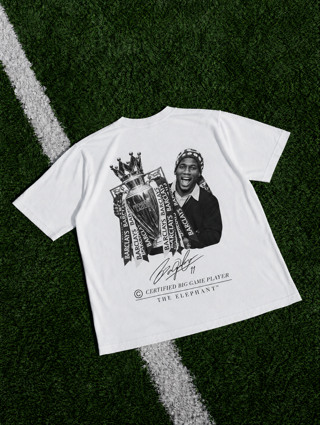 White heavyweight organic cotton T-shirt featuring a Didier Drogba-inspired football graphic with trophy artwork